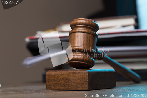 Image of Judge\'s hammer lies on table