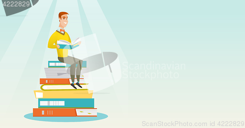 Image of Student sitting on huge pile of books.