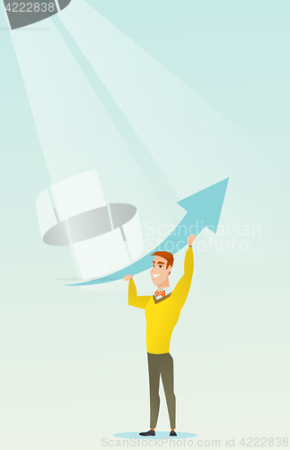 Image of Business man holding arrow going up.