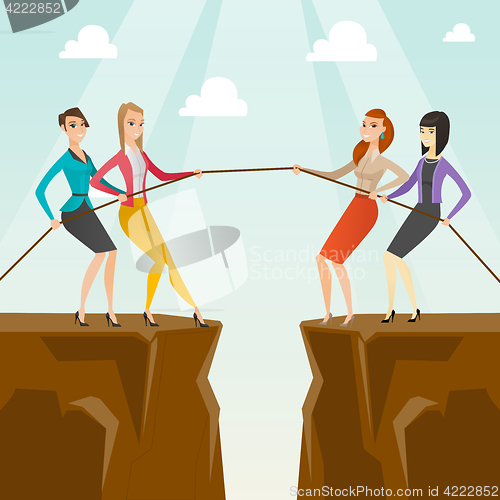 Image of Two groups of business people pulling rope.