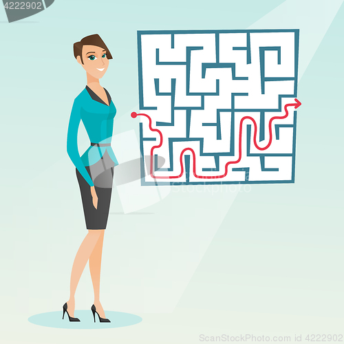 Image of Business woman looking at labyrinth with solution