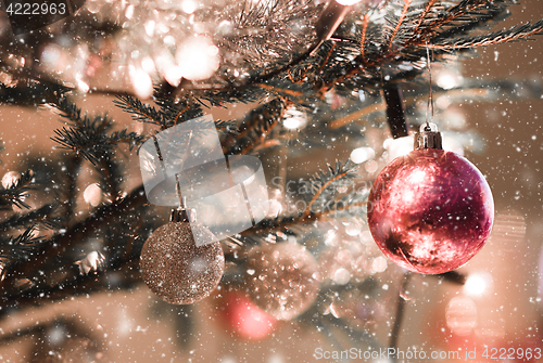 Image of Christmas decoration on tree with light