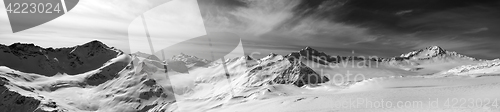 Image of Black and white panorama of Caucasus Mountains in snow winter ev