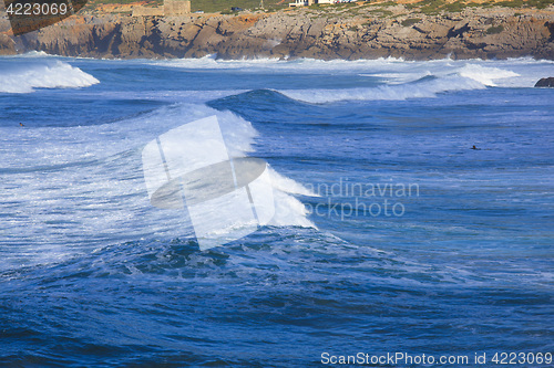 Image of Rocky Coast Extending into the Sea