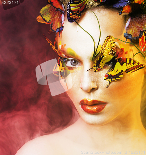 Image of woman with summer creative make up like fairy butterfly closeup 