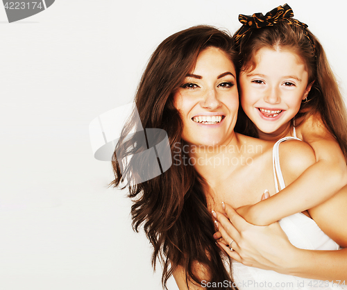 Image of young mother with little cute daughter emotional posing on white