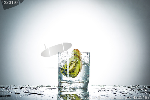 Image of water splash in glass of gray color