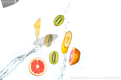 Image of Fresh fruits falling in water splash, isolated on white background