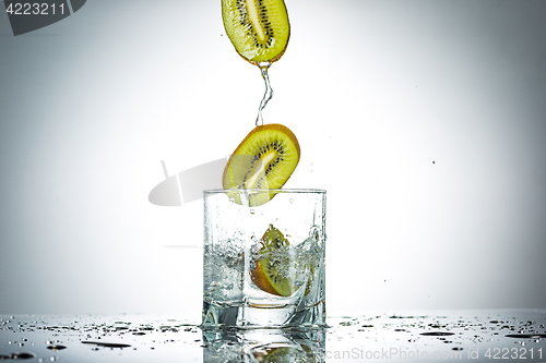 Image of water splash in glass of gray color