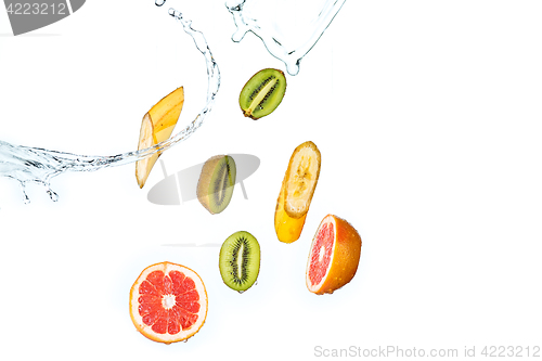 Image of Fresh fruits falling in water splash, isolated on white background