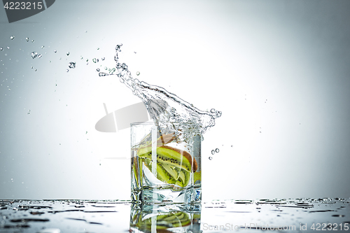 Image of water splash in glass of gray color