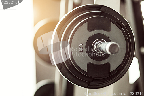 Image of Close up view of barbell on floor in gym