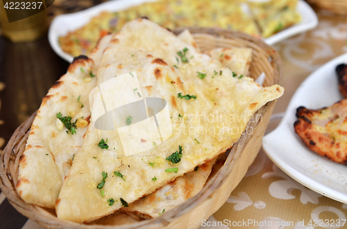 Image of Garlic and coriander naan on a basket
