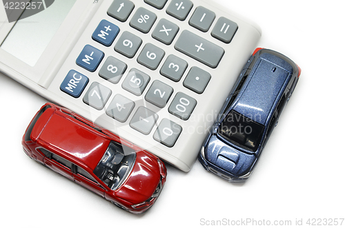 Image of Blue and red car with calculator