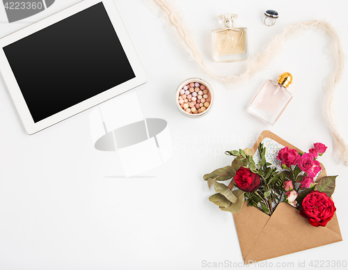 Image of Top view of white office female workspace with laptop