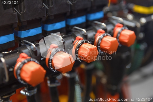 Image of Many red valves closeup