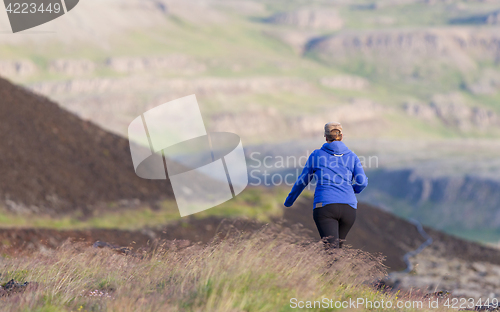 Image of Shot of a young woman hiking in Iceland