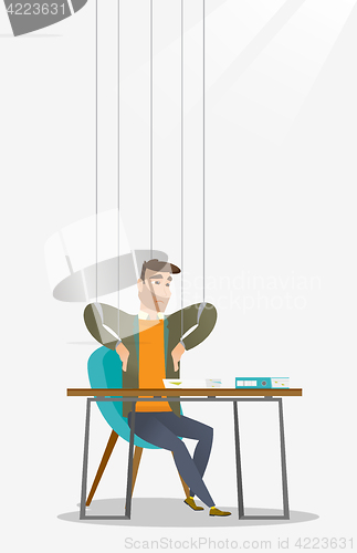 Image of Business man marionette on ropes working.