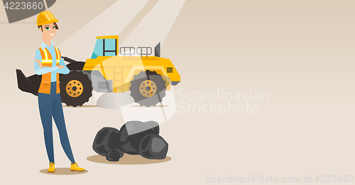 Image of Miner with a big excavator on background.