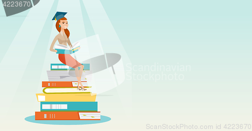 Image of Student sitting on huge pile of books.