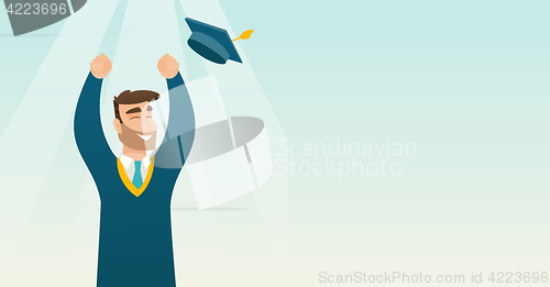 Image of Graduate throwing up graduation hat.