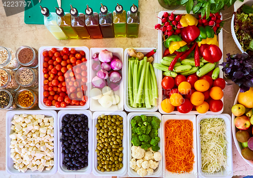 Image of Salad Bar Fresh Vegetables sliced Top view Tomato Carrot Celery Cucumber Cherry tomato Sweet pepper.