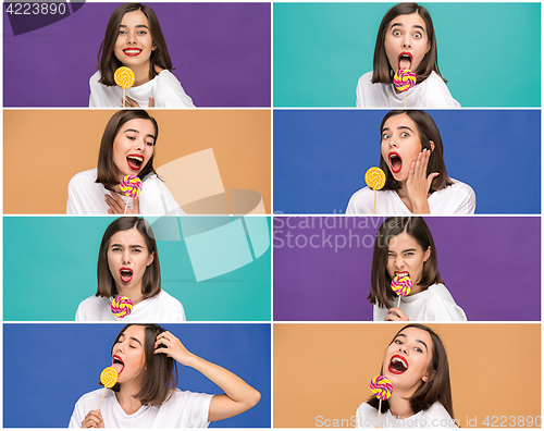 Image of young woman with the colorful lollipop at studio