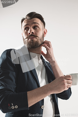 Image of Portrait of stylish handsome young man with cup of coffee