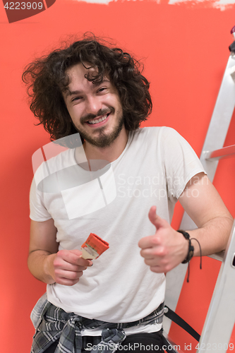 Image of man with funny hair over color background with brush