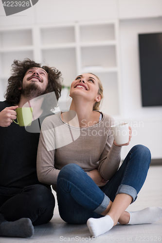 Image of young couple in their new home