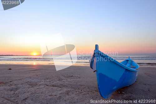 Image of Fishing boat and sunrise 