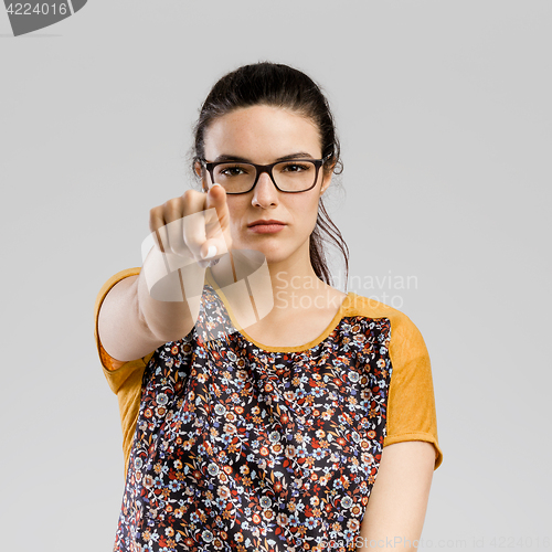 Image of Woman pointing to you