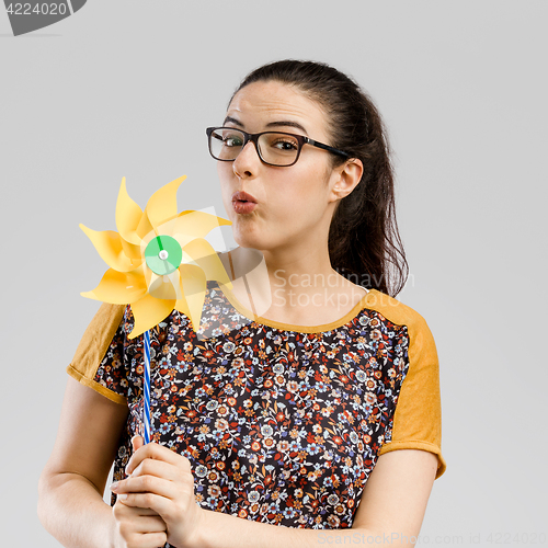 Image of Blowing a windmill