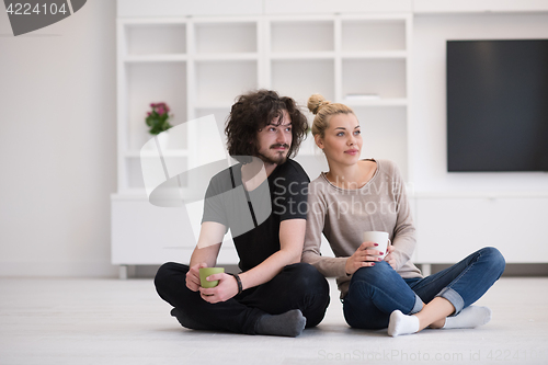 Image of young couple in their new home