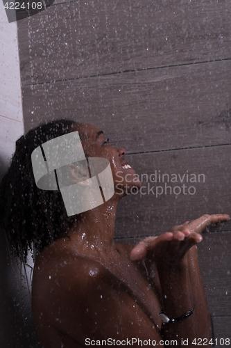 Image of African American woman in the shower