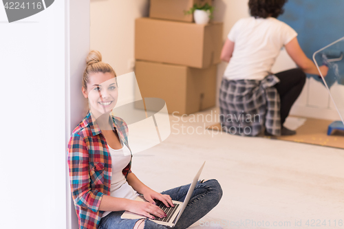 Image of Happy couple doing home renovations