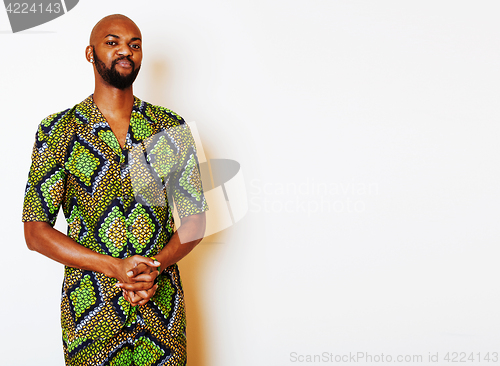 Image of portrait of young handsome african man wearing bright green nati
