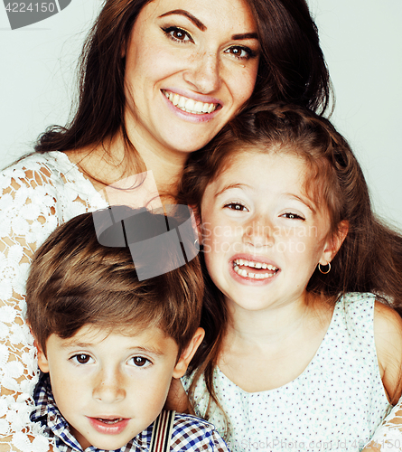 Image of young mother with two children on white, happy smiling family in