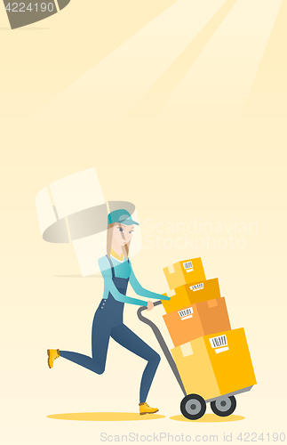 Image of Delivery postman with cardboard boxes on trolley.