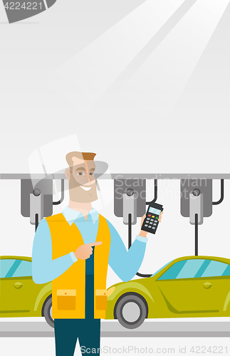 Image of Worker controlling automated assembly line for car