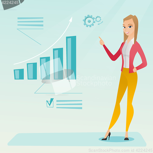 Image of Successful business woman pointing at chart.