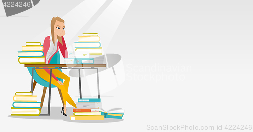 Image of Student sitting at the table with piles of books.