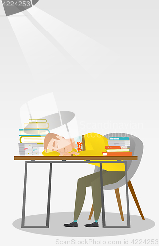 Image of Student sleeping at the desk with book.