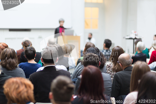 Image of Woman giving presentation on business conference.