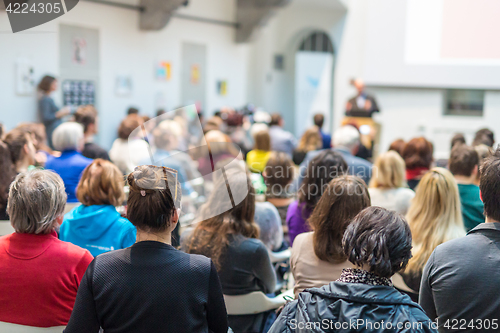 Image of Man giving presentation in lecture hall at university.