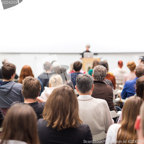 Image of Woman giving presentation on business conference.