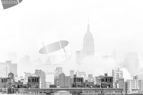 Image of Misty New York City Manhattan skyline with Empire State Building.