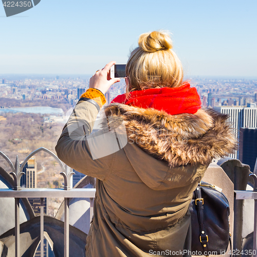 Image of Tourist taking photo of New York City.