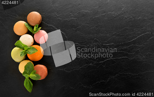 Image of Macarons on black table