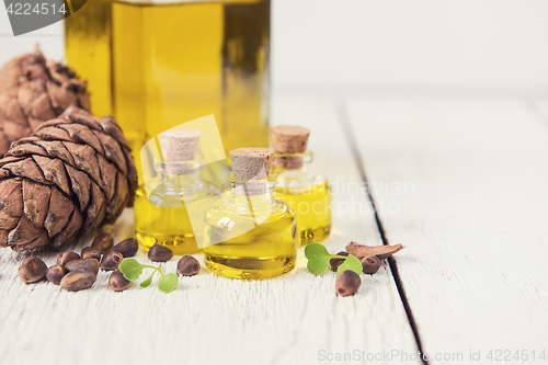 Image of The cedar oil in a glass bottle